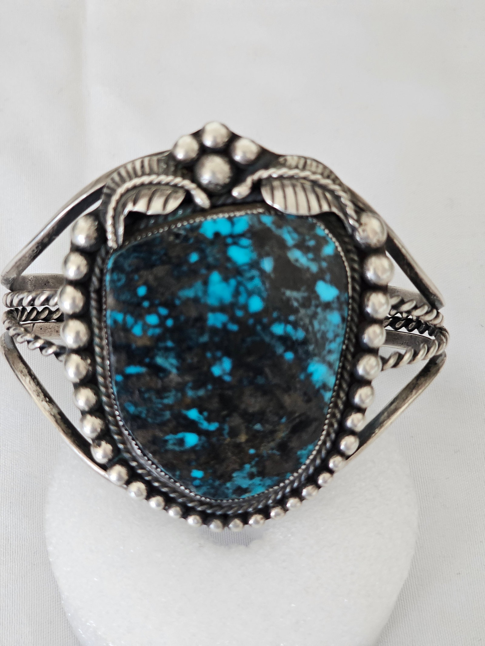 Red Mountain Turquoise Cuff With Etched ML, Possible Margaret Lee 60.37g: Sterling silver cuff bracelet set with a large Red Mountain turquoise stone and an etched ML mark. The possible Margaret Lee attribution is unconfirmed and should be treated cautiously, but the stone 