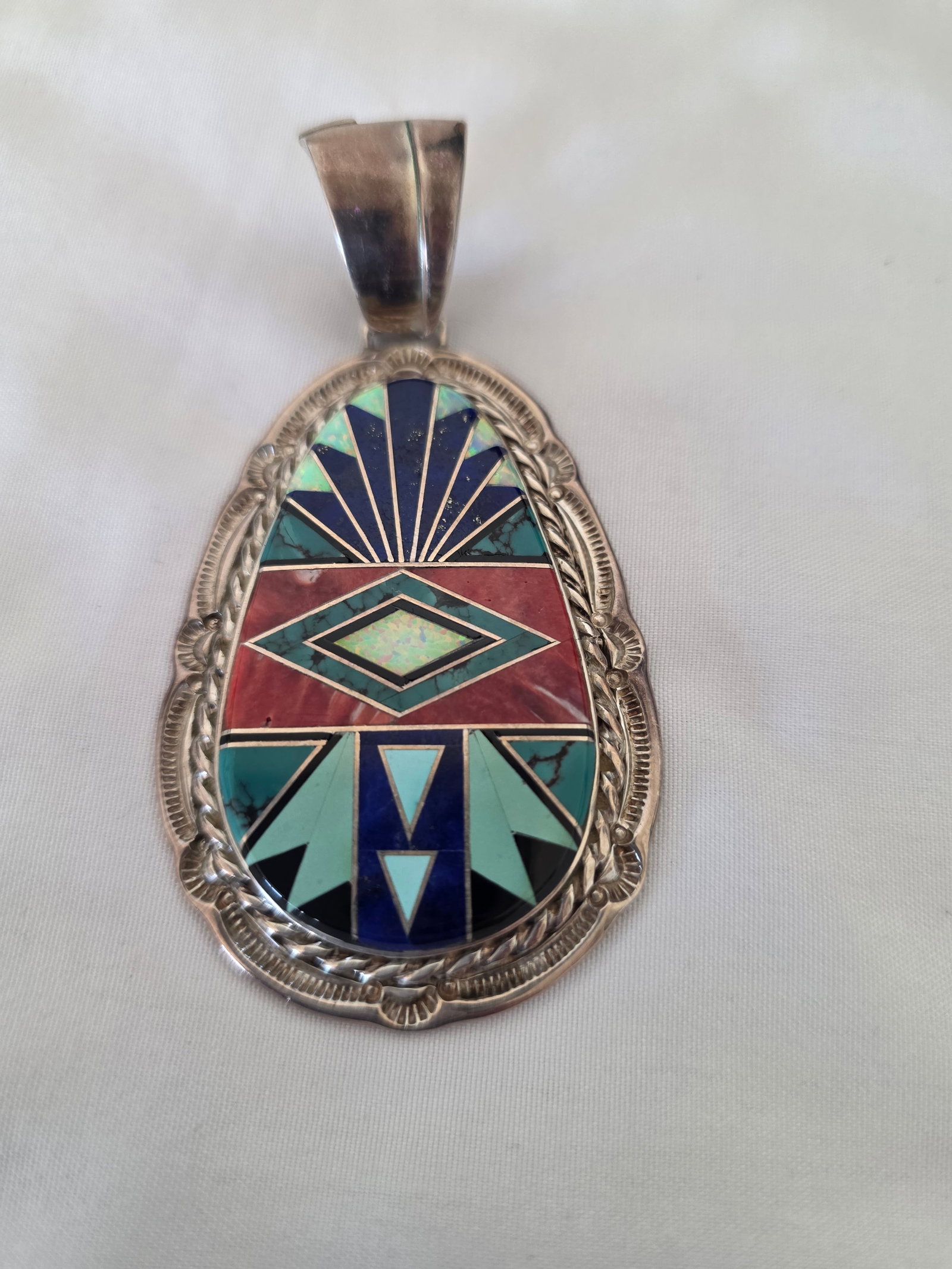 E. Kee Navajo Sterling Silver Multi-Stone Inlay Pendant 37.25g: Signed Navajo sterling silver multi-stone inlay pendant by E. Kee, referenced as Edith Kee, Navajo artist. The pendant features a large teardrop-shaped inlay panel set in a substantial sterling silver