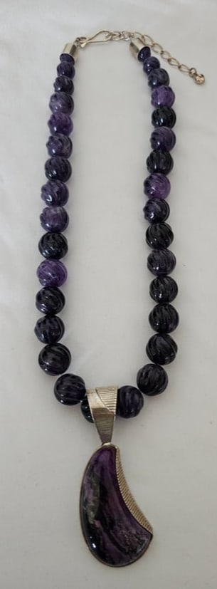 DTR Sterling Silver Purple Gemstone Necklace With Pendant: Sterling silver purple gemstone necklace with pendant, marked DTR China 925. The necklace combines purple gemstone beads with a matching pendant drop and adjustable length.A decorative purple gemstone