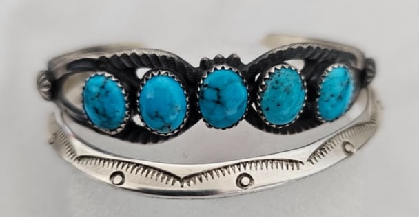 Lot of 2 Sterling Silver Stacker Cuffs One Turquoise K Billah Signed 53g: Pair of sterling silver stacker cuffs offered together as one lot. The first cuff features five oval turquoise cabochons set across an openwork silver face, with bright blue stones showing natural dar
