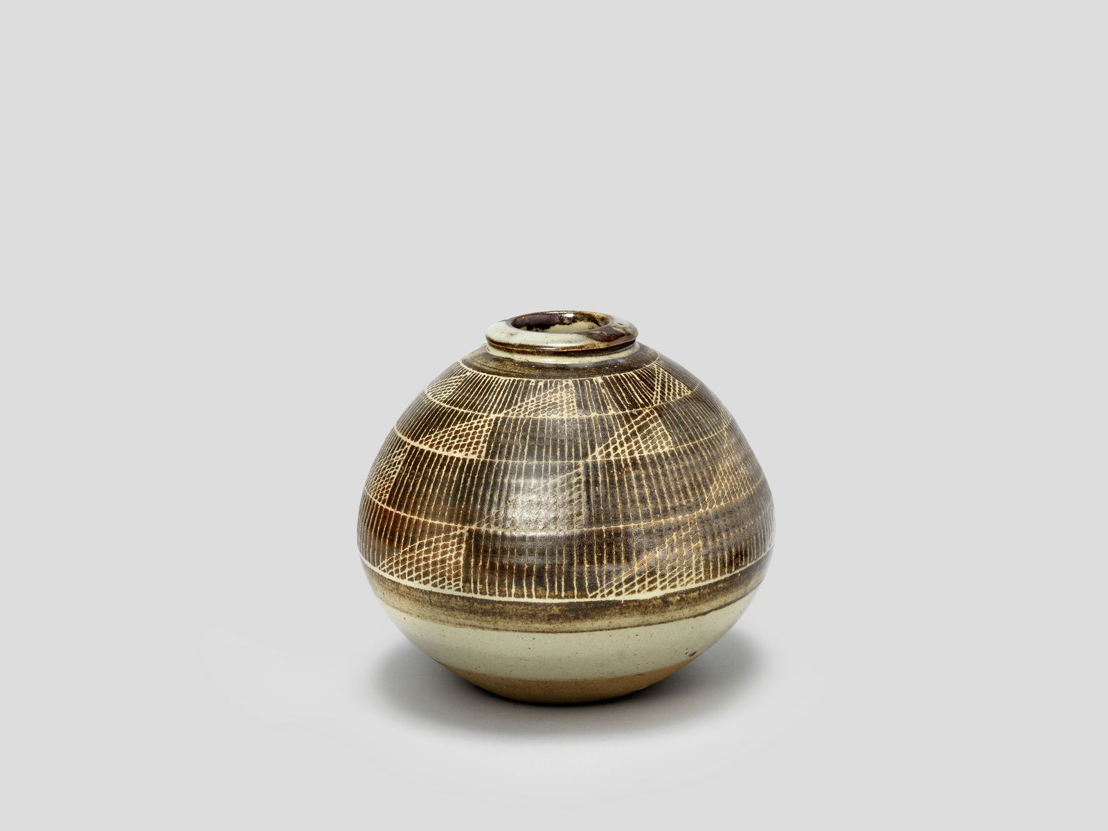 Bernard Leach Vase, circa 1960: Bernard Leach Vase, circa 1960 Stoneware, with geometric linear pattern. 18 cm high Impressed with artist's BL seal and St Ives mark. This lot is subject to the following lot symbols: AR AR Go