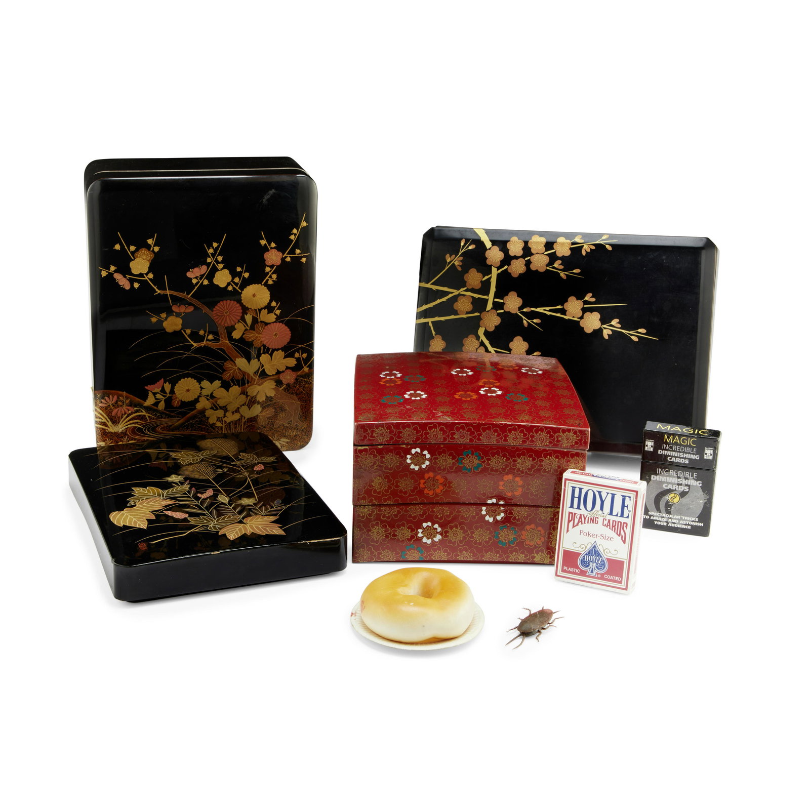 A Marlon Brando group of Japanese decorative boxes: A Marlon Brando group of Japanese decorative boxes Four Japanese imitation lacquer boxes, comprising three black rectangular boxes with foliate decoration to the lids and one square red box decorated