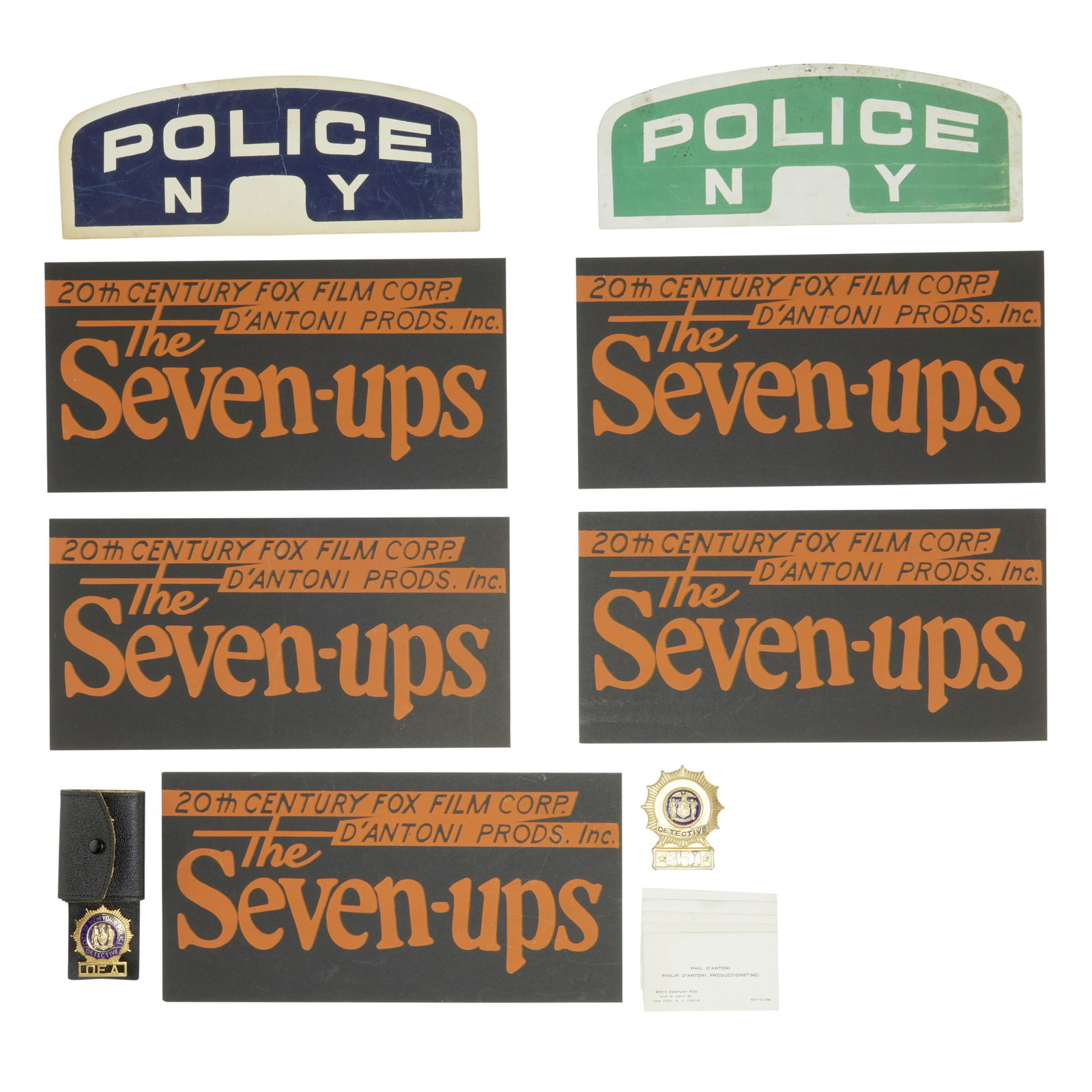 A Philip D'Antoni group of police memorabilia relating: A Philip D'Antoni group of police memorabilia relating to The French Connection and The Seven-Ups Comprising 4 cardboard signs with stenciled lettering, '20th Century Fox Film Corp. / D'Antoni Prods.