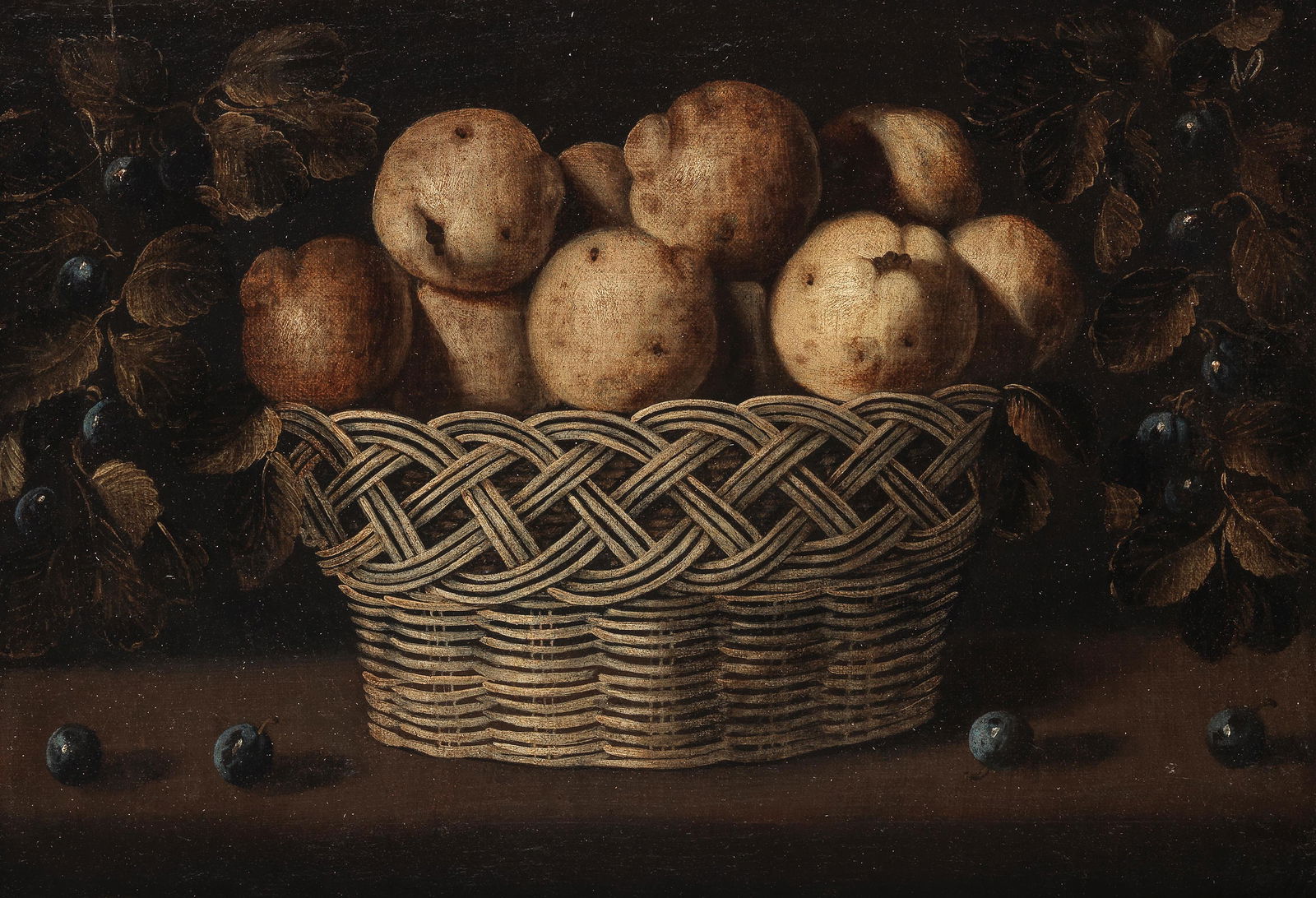 Attributed to Juan van der Hamen y León (Madrid: ATTRIBUTED TO JUAN VAN DER HAMEN Y LEÓN (MADRID 1596-1632) A still life with a basket of quinces on a wooden table and damsons hanging from strings on either side oil on canvas 39.6 x 57.8cm (15