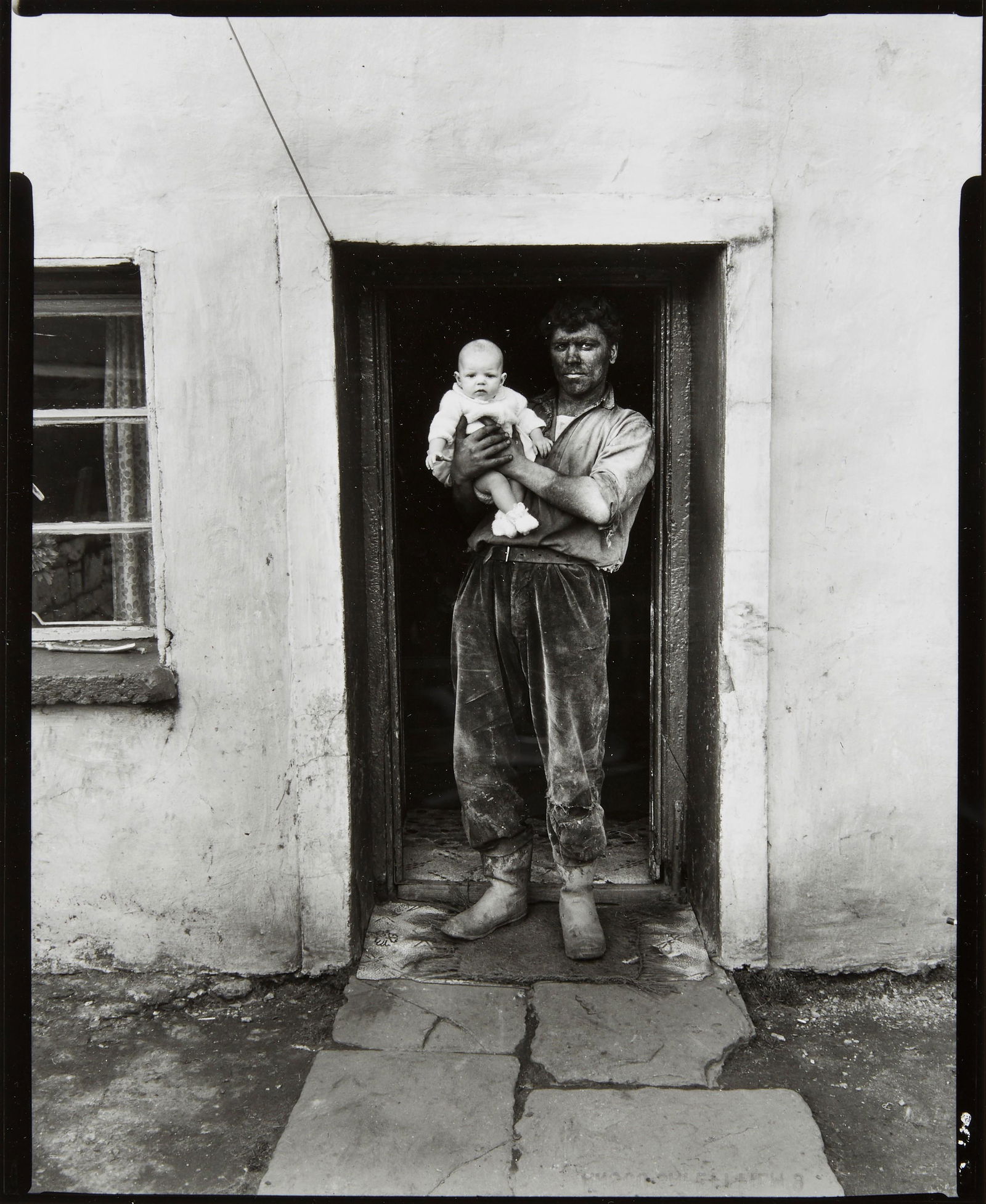 Bruce Davidson (born 1933); Father and Son, South Wales;: Bruce Davidson (born 1933) Father and Son, South Wales, 1965 Gelatin silver print, printed later, signed in pencil on the verso. 10 3/4 x 8 1/2in (27.3 x 21.5cm) sheet 14 x 11in (35.5 x 27.9cm) Footno