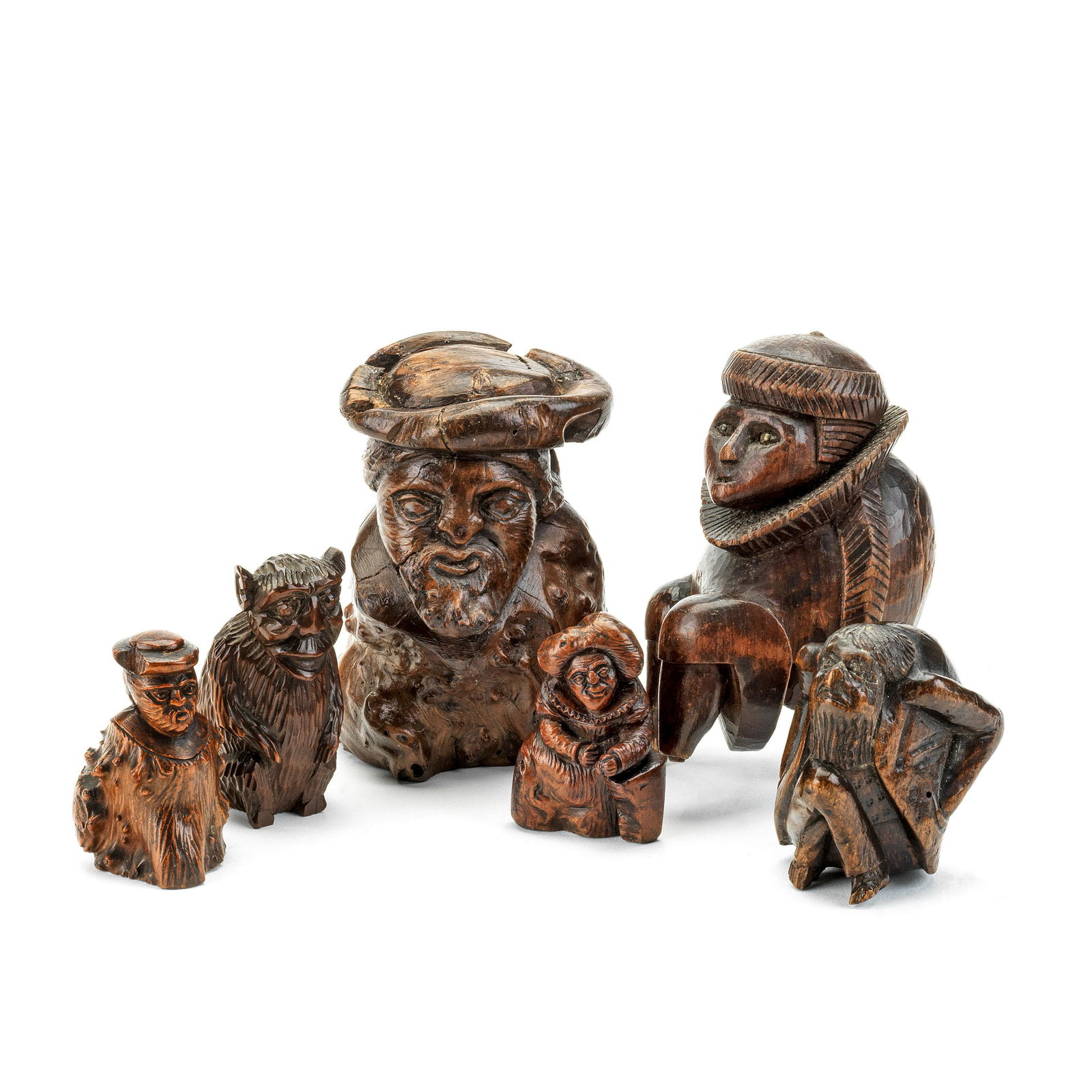 A Collection Of Three Carved Root Wood Figures, A: A collection of three carved root wood figures, a figural snuff box and two nut crackers 19th century The nutcrackers in the form of a monkey and an old man, lacking screws, the figural snuff box: 7