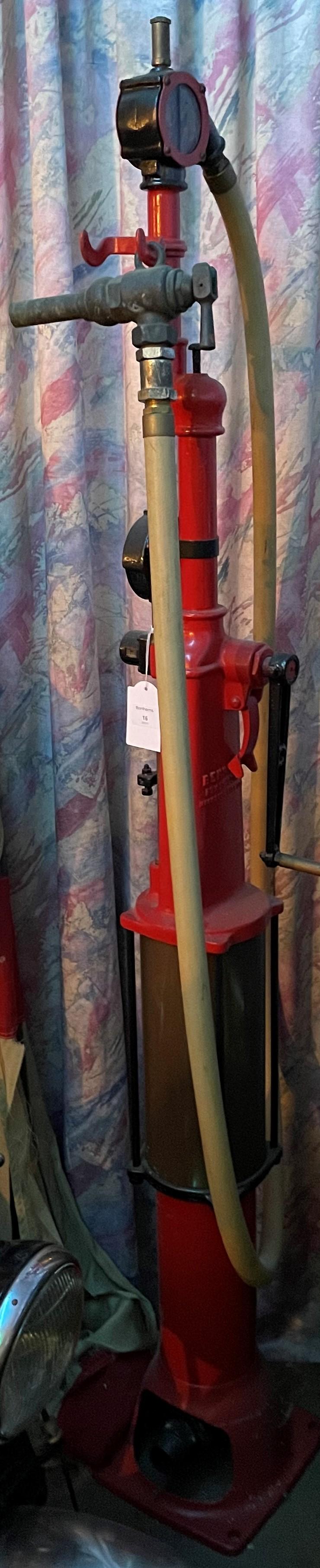 A HAND-CRANKED SKELETON PETROL PUMP BY BENNETT PUMPS: A hand-cranked skeleton petrol pump by Bennett Pumps Corp, Michigan, USA, painted red, numbered BP216, CWC-2 5-6, 175cm high, with hose and bronze nozzle. This lot is subject to the following lot symb