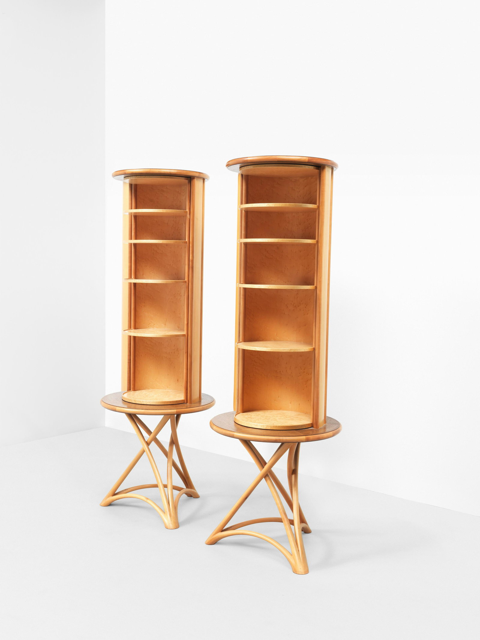 JOHN MAKEPEACE OBE: John Makepeace OBE Unique pair of cylindrical and rotating cabinets, designed for a private commission, London, 1985-1986 Wenge-veneered wood, cherry, birds-eye maple. Each: 181 cm high, 65 cm diamete