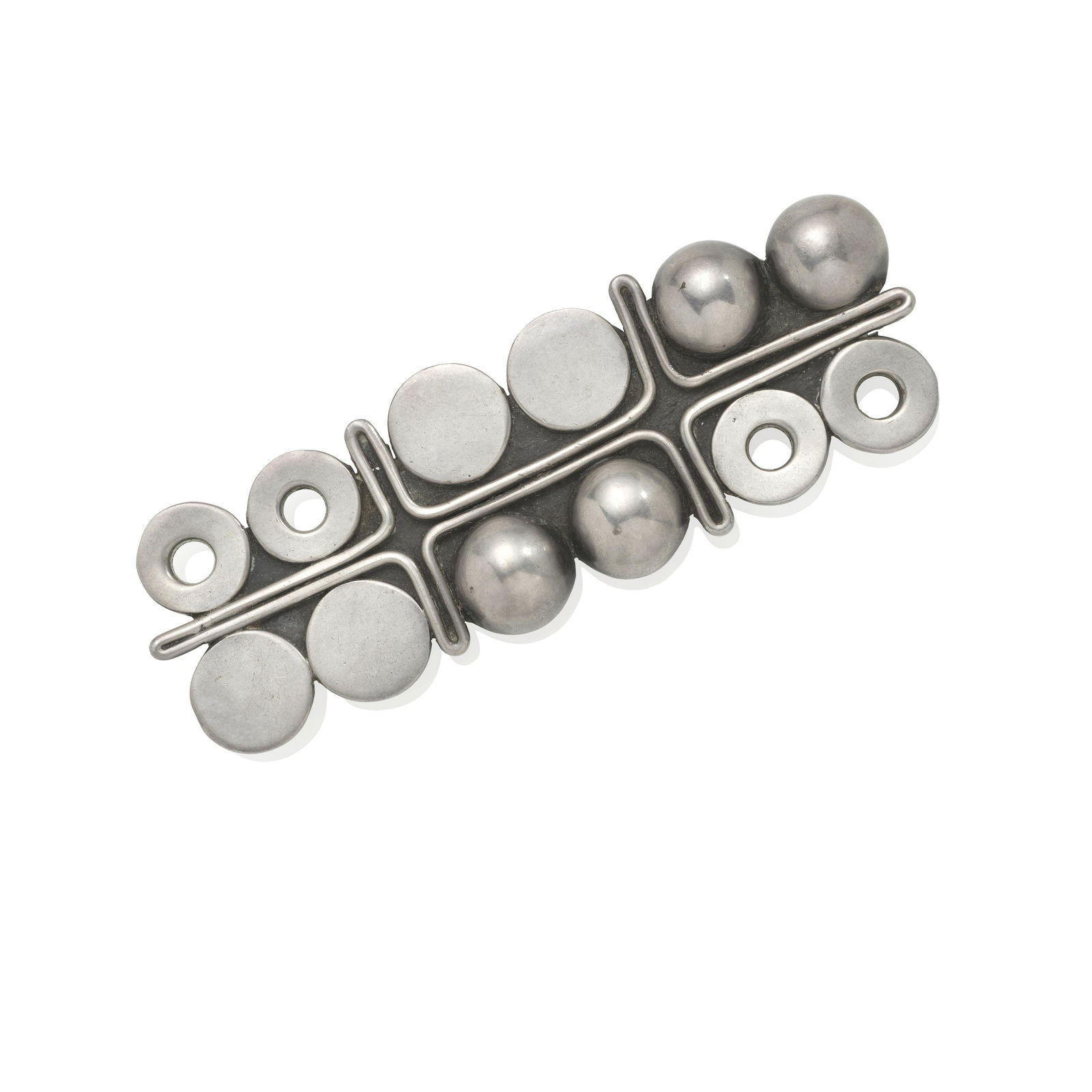 A SILVER BROOCH, MARGARET DE PATTA: A SILVER BROOCH, MARGARET DE PATTA The rectangular brooch designed with assorted circular elements; mounted in sterling silver; length 3 3/4 in.; with maker's mark for Margaret de Patta, Sterling