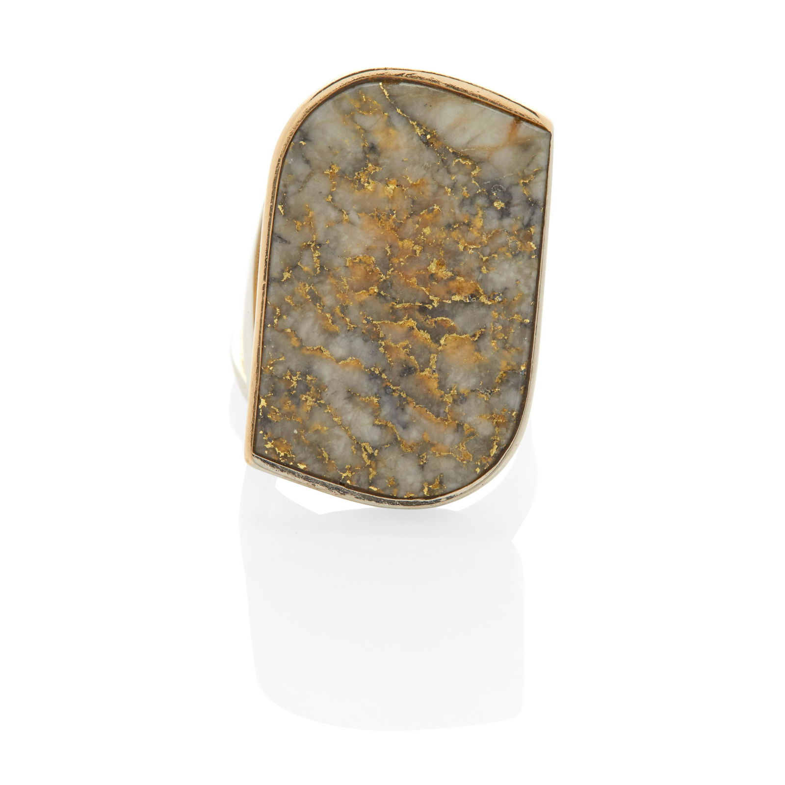 A BI-COLOR GOLD AND GOLD-IN-QUARTZ RING, MARGARET DE: A BI-COLOR GOLD AND GOLD-IN-QUARTZ RING, MARGARET DE PATTA Designed with a bezel-set gold-in-quartz plaque on a yellow gold mount with white gold accent; size 9; signed de Patta, with maker's mark Foo