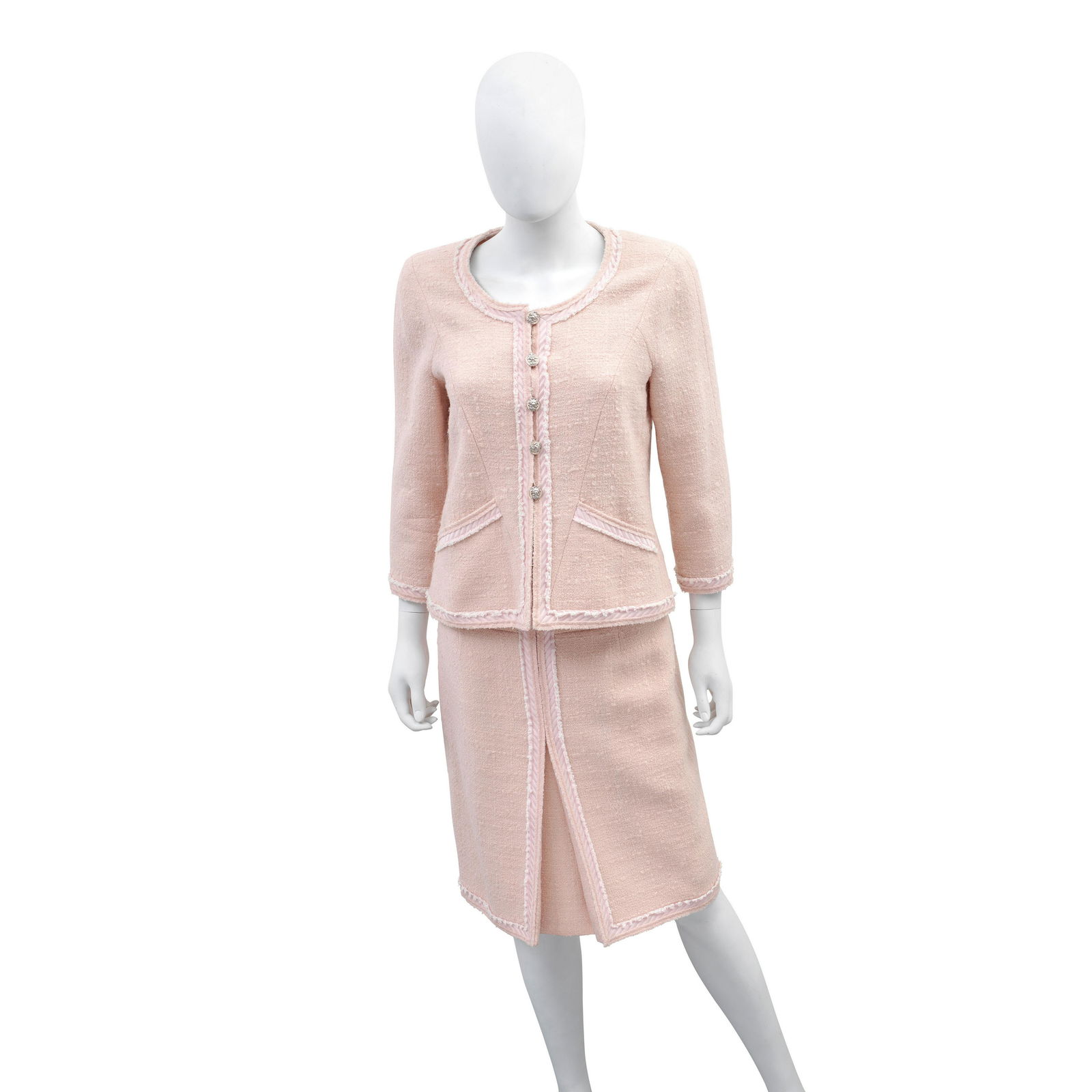 A PINK BOUCLE SKIRT SUIT Chanel, Versailles Collection,: A PINK BOUCLE SKIRT SUIT Chanel, Versailles Collection, 2013 Pale pink boucle with frayed ribbon trim and silver tone lion head buttons, jacket with round collar and bracelet sleeves, skirt knee-lengt