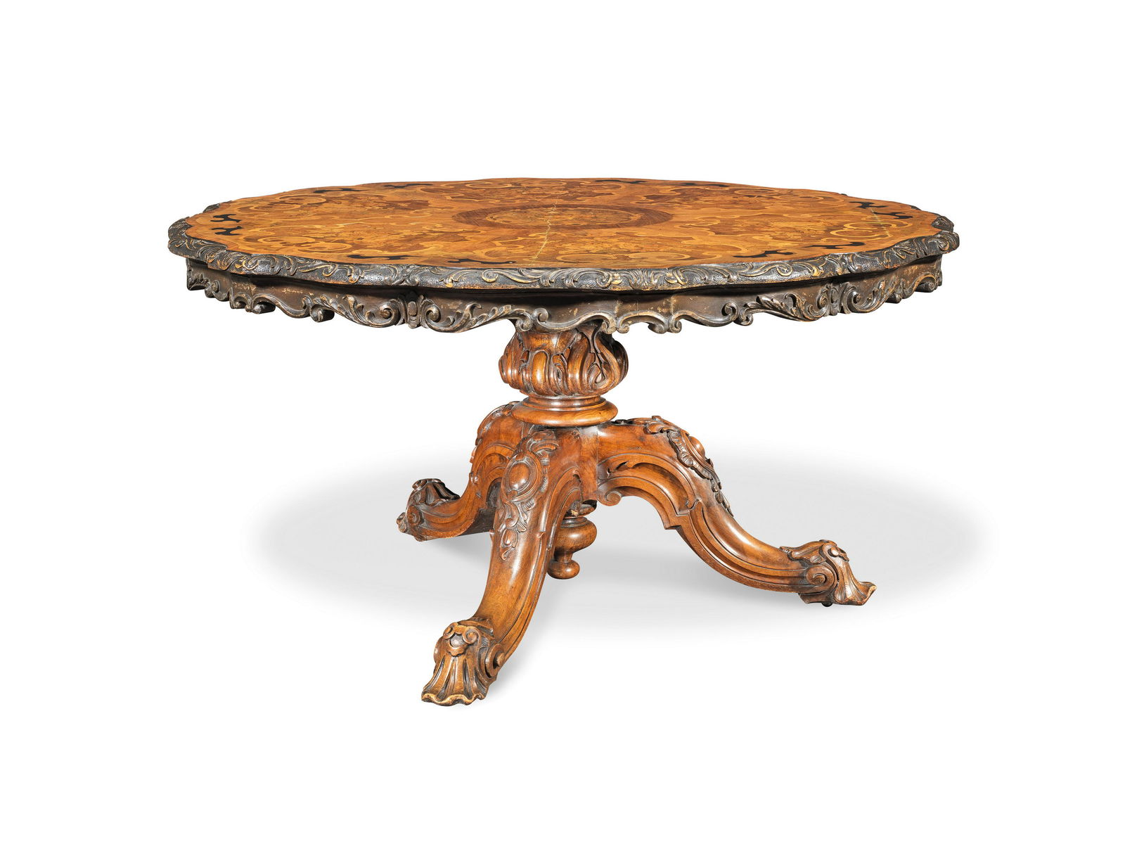 A mid Victorian walnut, tulipwood banded, ebonised and: A mid Victorian walnut, tulipwood banded, ebonised and fruitwood marquetry breakfast table in the manner of Edward Holmes Baldock Circa 1860, the shaped segmentally veneered circular top inlaid with a