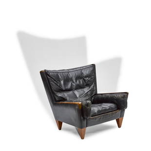Illum Wikkelso (1919-1999): The cataloging for the present lot has been updated as below: Illum Wikkelso (1919-1999) V11 Chair 1960s for Holger Christiansen, mahogany, leather height 33in (83.8cm); width 33 3/4in (85.7cm); depth