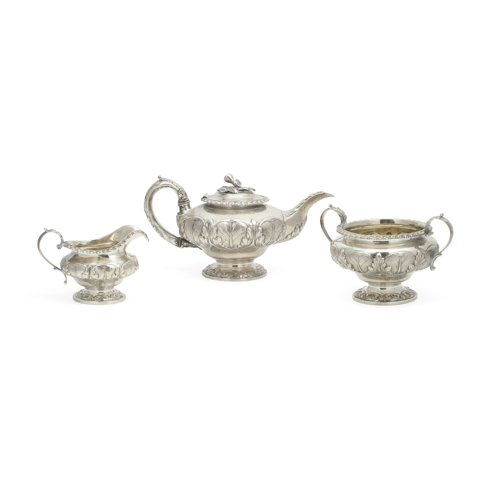 AN ENGLISH SILVER ASSEMBLED THREE-PIECE TEA SERVICE by: AN ENGLISH SILVER ASSEMBLED THREE-PIECE TEA SERVICE by various makers, London, mid-19th century Comprising a tea pot and a two-handled sugar bowl by William Collins, 1833 and a creamer by Richard Pear