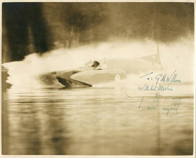 CAMPBELL (DONALD MALCOLM) Photograph depicting Bluebird: CAMPBELL (DONALD MALCOLM)Photograph depicting Bluebird K7 at speed, signed and inscribed in ink ('To: G.M. Williams/ With best wishes/ from/ Donald Campbell'), stamp of Hallawell press photographers