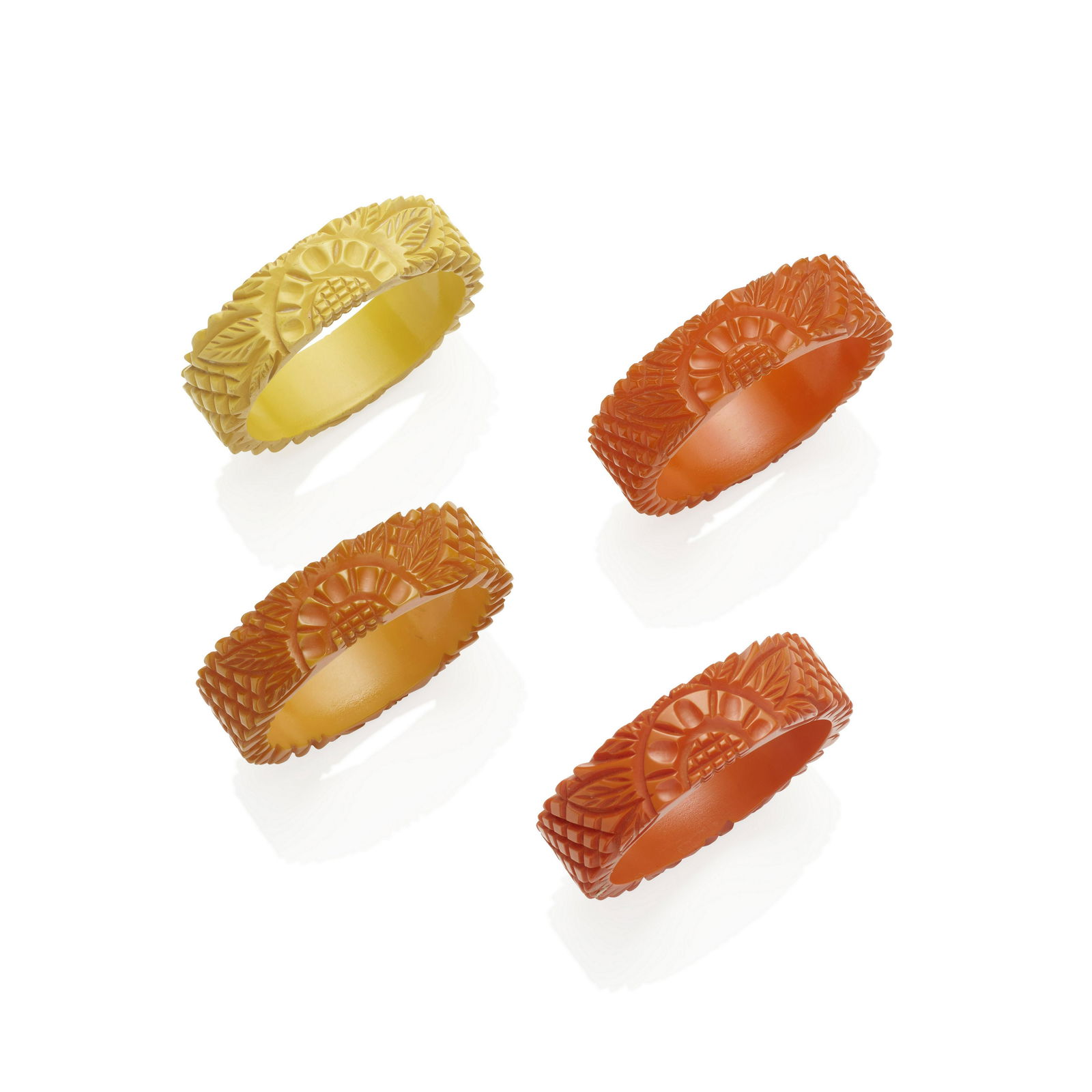FOUR BAKELITE CARVED 'FLOWER' BANGLE BRACELETS (1 of 1)
