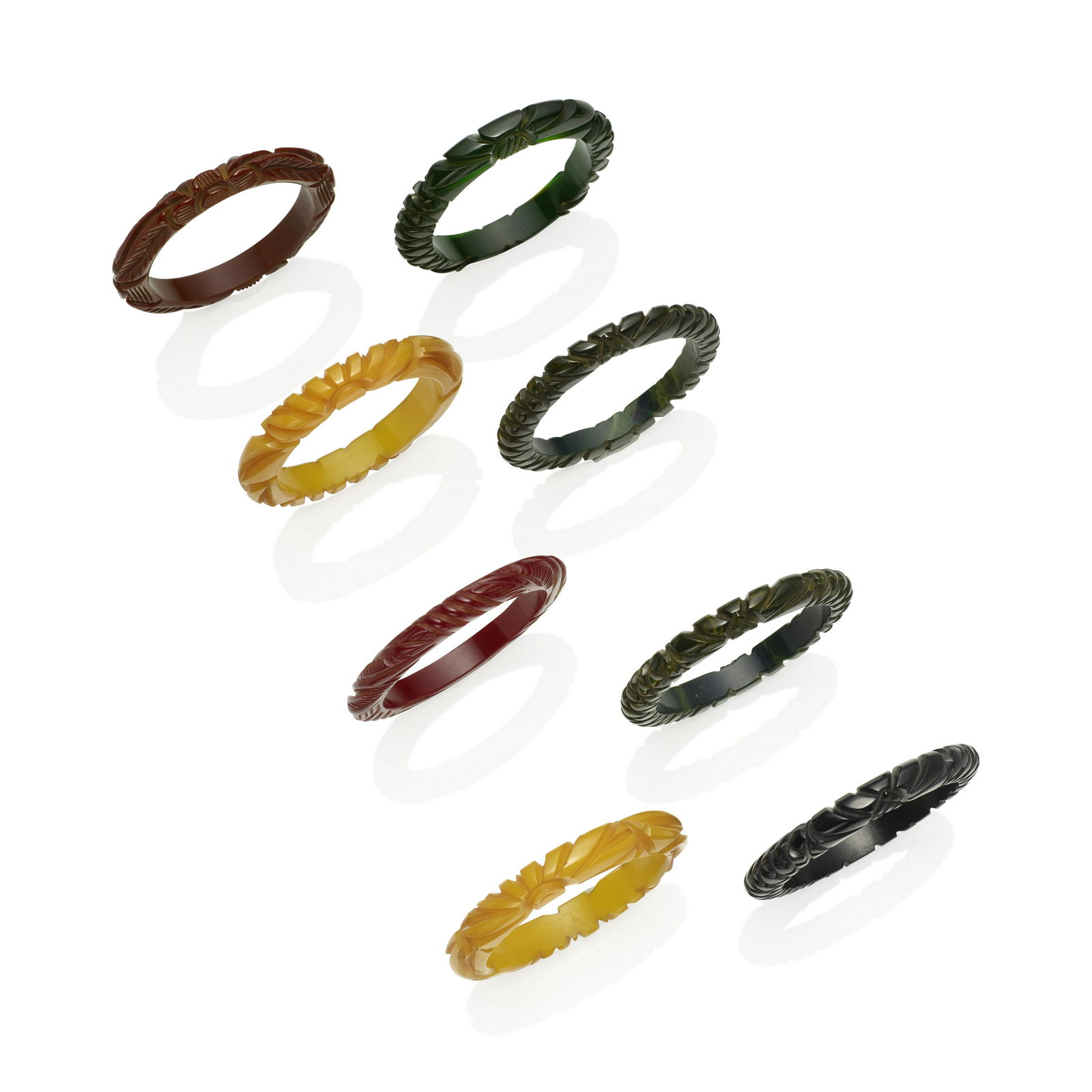EIGHT BAKELITE CARVED BANGLE BRACELETS (1 of 1)