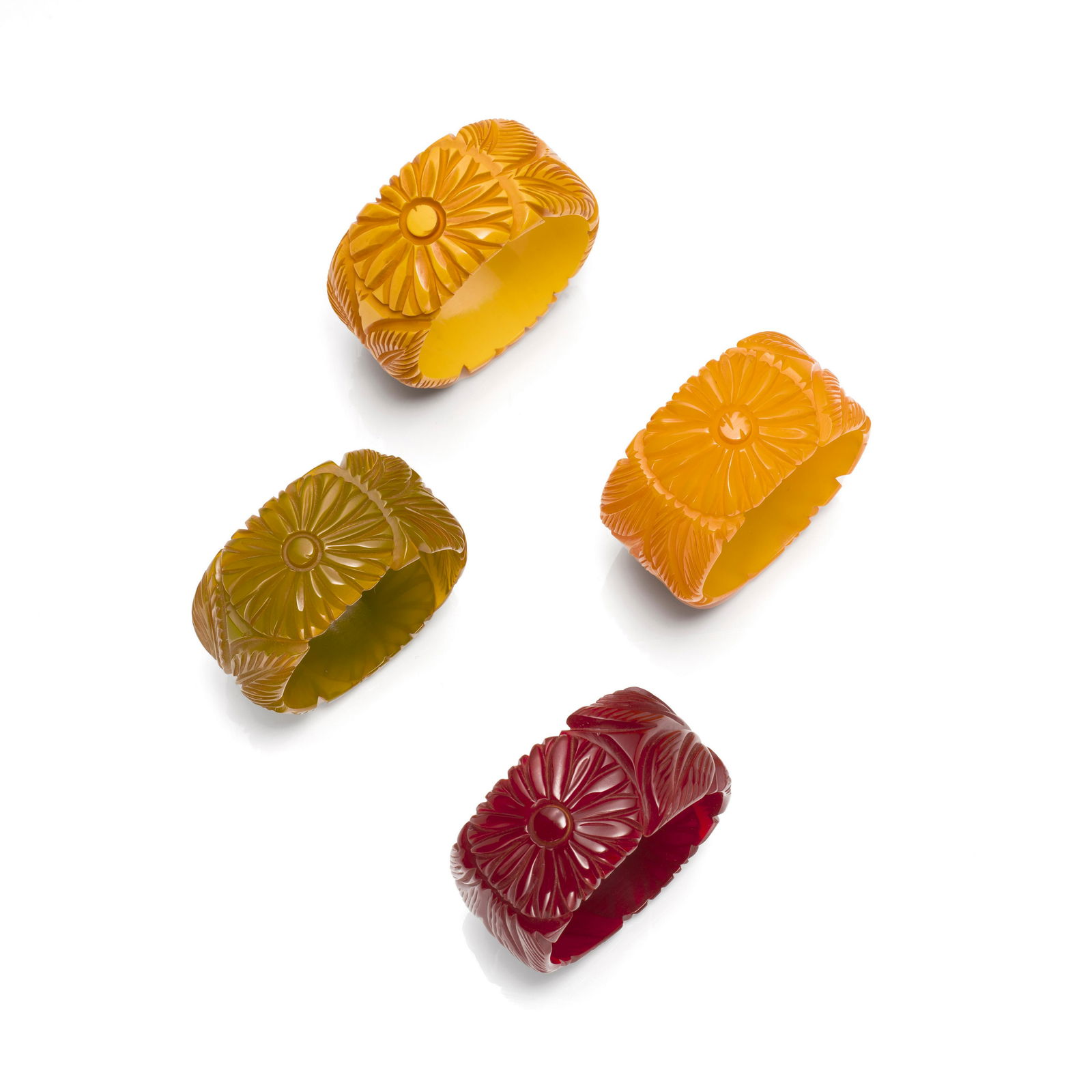 FOUR BAKELITE CARVED 'FLOWER' BANGLE BRACELETS (1 of 1)