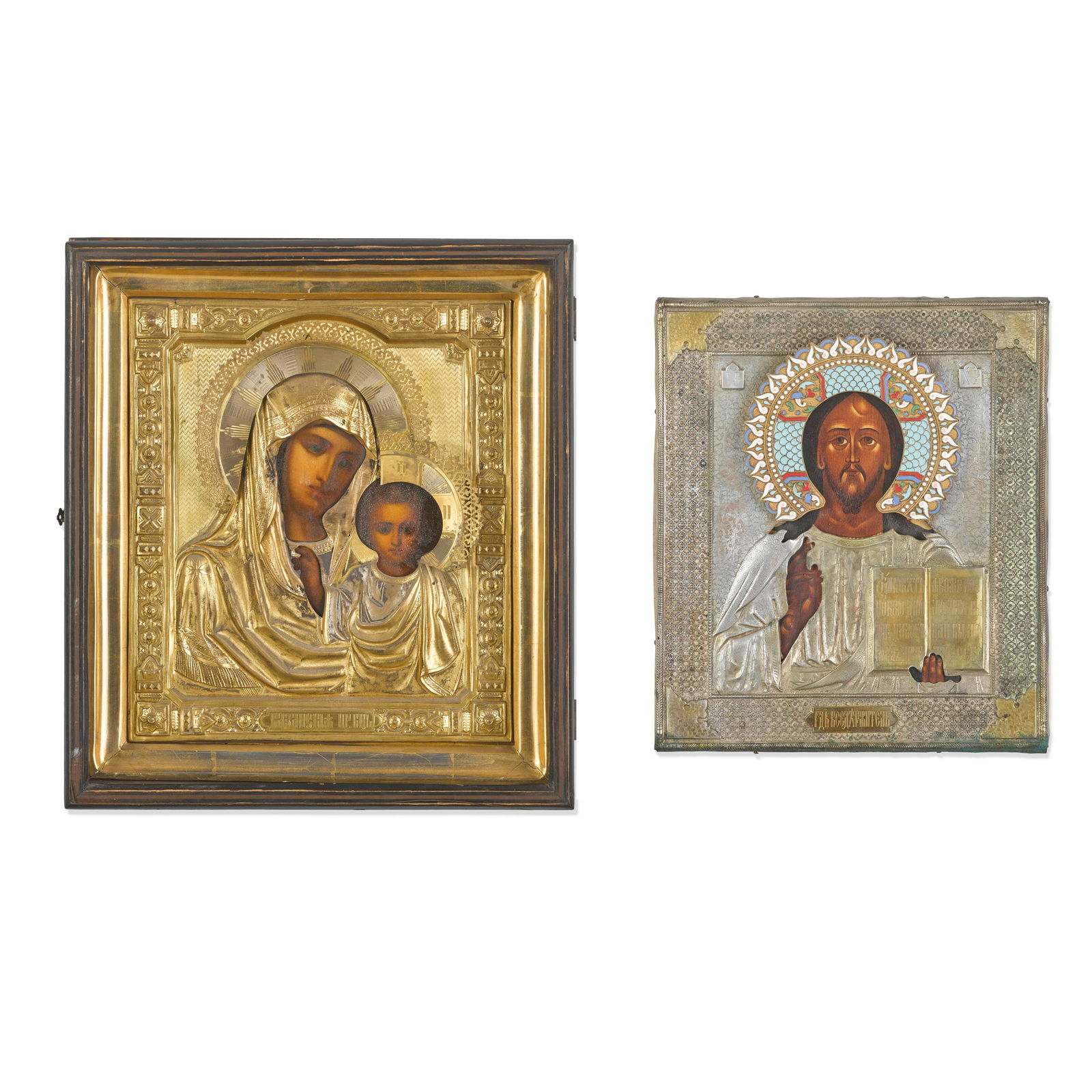 TWO RUSSIAN SILVER-CLAD PAINTED WOOD ICONS (1 of 3)