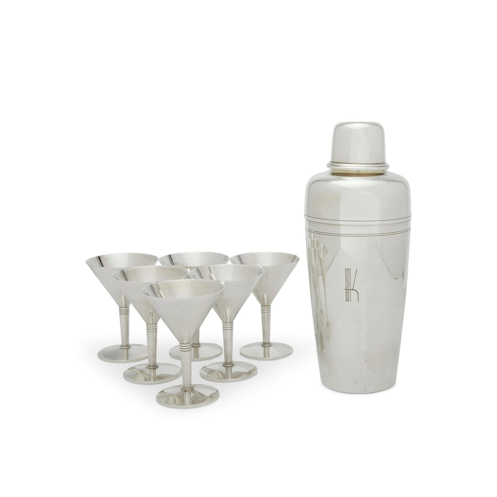 Tiffany & Co. (Founded 1837) Seven Piece Cocktail: Tiffany & Co. (Founded 1837) Seven Piece Cocktail Set sterling silver, comprising a shaker and six martini glasses, shaker stamped 'TIFFANY & CO MAKERS STERLING SILVER 22423 M', glasses stamped 'TIFFA