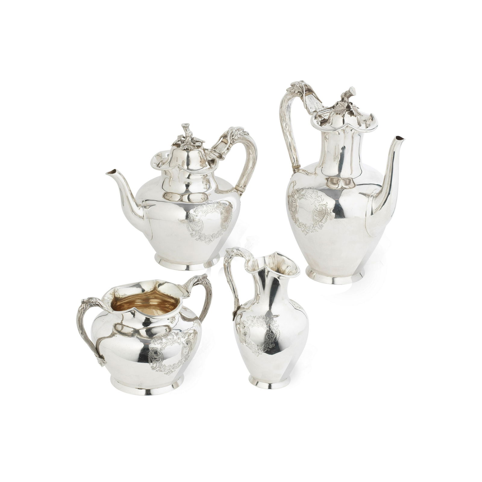 A Victorian silver four-piece tea and coffee service Stephen Smith & William Nicholson, London 1...: A Victorian silver four-piece tea and coffee service Stephen Smith & William Nicholson, London 1855 - 1857 Plain baluster form with incurved neck flaring to a quatrefoil rim, the naturalist vine handl