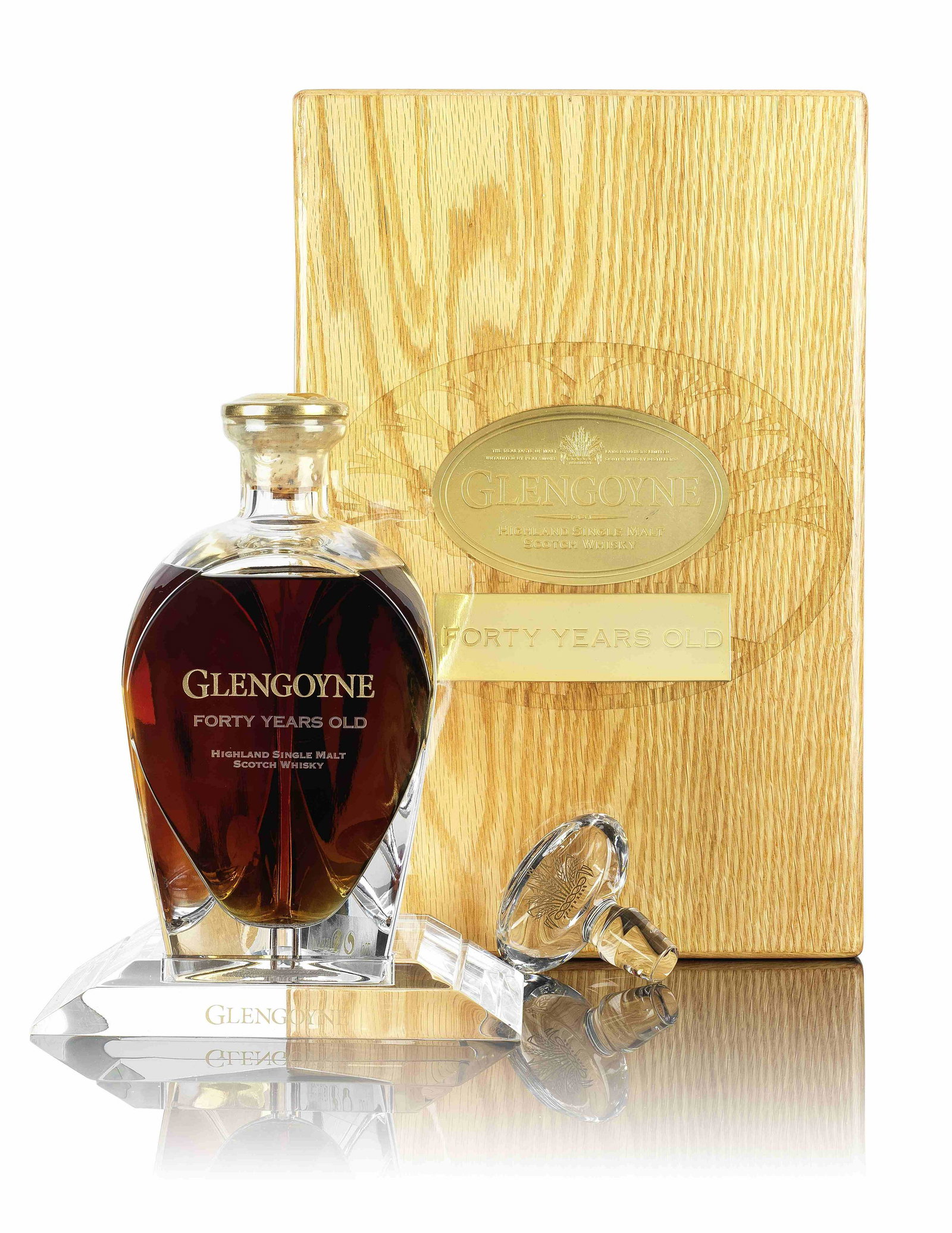Glengoyne-40 year old-1968: Glengoyne-40 year old-1968 Distilled by Glengoyne Distillery. Crystal decanter No. 67. In original presentation wooden case, accompanied by booklet and stopper and outer packaging. Engraved labelling.