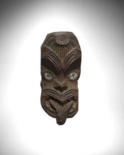 Maori Gable Mask Ornament, Rotarua, New Zealand: Maori Gable Mask Ornament, Rotarua, New Zealandkoruru Wood with dark brown patina, paua shellHeight 17in (43.2cm)ProvenanceSotheby's, London, 3 July 1978, Lot 286California Private