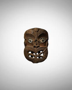 Maori Gable Mask, New Zealand: Maori Gable Mask, New Zealandkoruru Dark brown wood red pigment, paua shell eyesHeight 12 1/2in (31.5cm)ProvenanceAngus James Braggins (b. 1867), AucklandAccording to family records, Angus Braggins