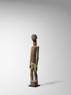 Lobi Male Figure, Burkina Faso: Lobi Male Figure, Burkina Fasobateba Wood with light brown encrusted patinaHeight 13 1/4in (33.5cm) ProvenanceIrwin and Marcia Hersey Collection, New YorkSwiss Private Collection, acquired from the