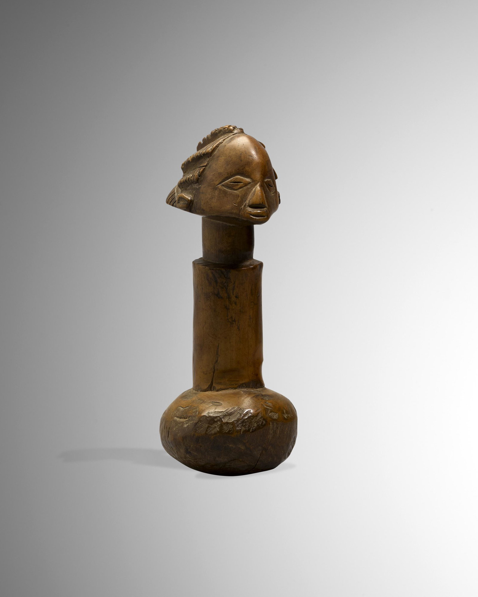 Luba-Kalundwe Pestle, Democratic Republic of the Congo: Luba-Kalundwe Pestle, Democratic Republic of the Congo lubuko Wood with shiny light brown patina Height 8 1/2in (21.5cm) Provenance Alan Brandt, Inc., Works of Art, New York Lucille and Harold Straus