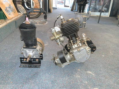 A Blackburne engine ((2)): A Blackburne enginenumbered OCA1856 (overstamped) together with an unidentified engine; unnumbered and mounted on a metal base. It is not known whether these are motorcycle, stationary or car