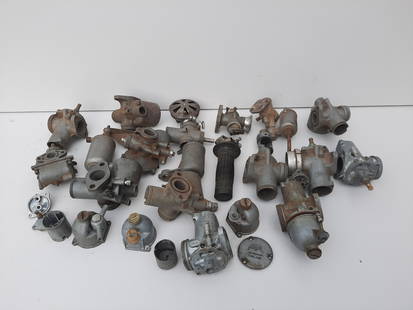 A quantity of carburettors ((Qty)): A quantity of carburettorsincluding an early Bowden carburettor, an Amal L932/27, a 930/L93, a 376/7 and various others together with sundry items. (Qty)Lot to be sold without reserve.