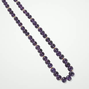 Amethyst Necklace with Gold Spacers: Amethyst Necklace with Gold SpacersZambiaPolished into beads in Jaipur, this fine single-strand necklace consists of slightly rondelle-form amethyst beads with rich violet hue, graduating from 8.18mm