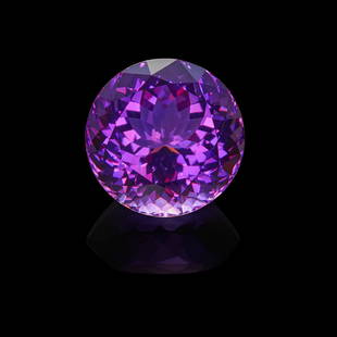 Fine Amethyst--'A MEMBER OF 100 CARATS CLUB': Fine Amethyst--'A MEMBER OF 100 CARATS CLUB'BrazilA large circular-cut amethyst with an attractive violet hue having excellent luster and clarity. Weighing approximately 133.50 carats and measuring