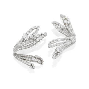 MELLERIO: PAIR OF DIAMOND CLIPS, CIRCA 1950: MELLERIO: PAIR OF DIAMOND CLIPS, CIRCA 1950 Each openwork ribbon spray set with baguette, brilliant and single-cut diamonds, diamonds approximately 13.15 carats total, signed Mellerio Paris, numbered