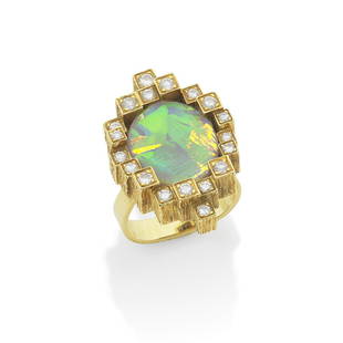 GRIMA: OPAL AND DIAMOND DRESS RING, 1984: GRIMA: OPAL AND DIAMOND DRESS RING, 1984The oval opal cabochon within a heavily engraved castellated border set with brilliant-cut diamonds, mounted in 18 carat yellow gold, signed Grima and AG.