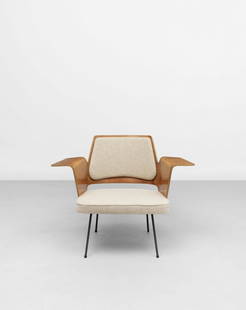Robin Day Armchair, model no. 700, circa 1956: Robin DayArmchair, model no. 700, circa 1956Walnut-veneered plywood, painted steel, fabric upholstery.67.5 x 89.5 x 64 cm Manufactured by Hille, London, United Kingdom. Footnotes:LiteraturePenny
