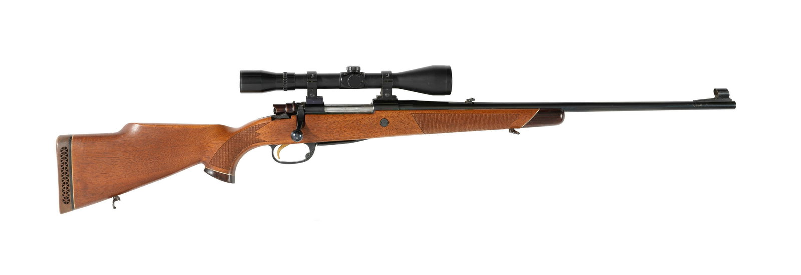 A .243 (Win.) bolt-magazine rifle by Parker Hale, no. C07529 with a 4x45 'Champion' telescopic s...: A .243 (Win.) bolt-magazine rifle by Parker Hale, no. C07529 Side-safety, removable magazine, the stock with pistolgrip, pistolgrip-cap, cheek-piece and rubber recoil-pad, sling swivels with sling, ro