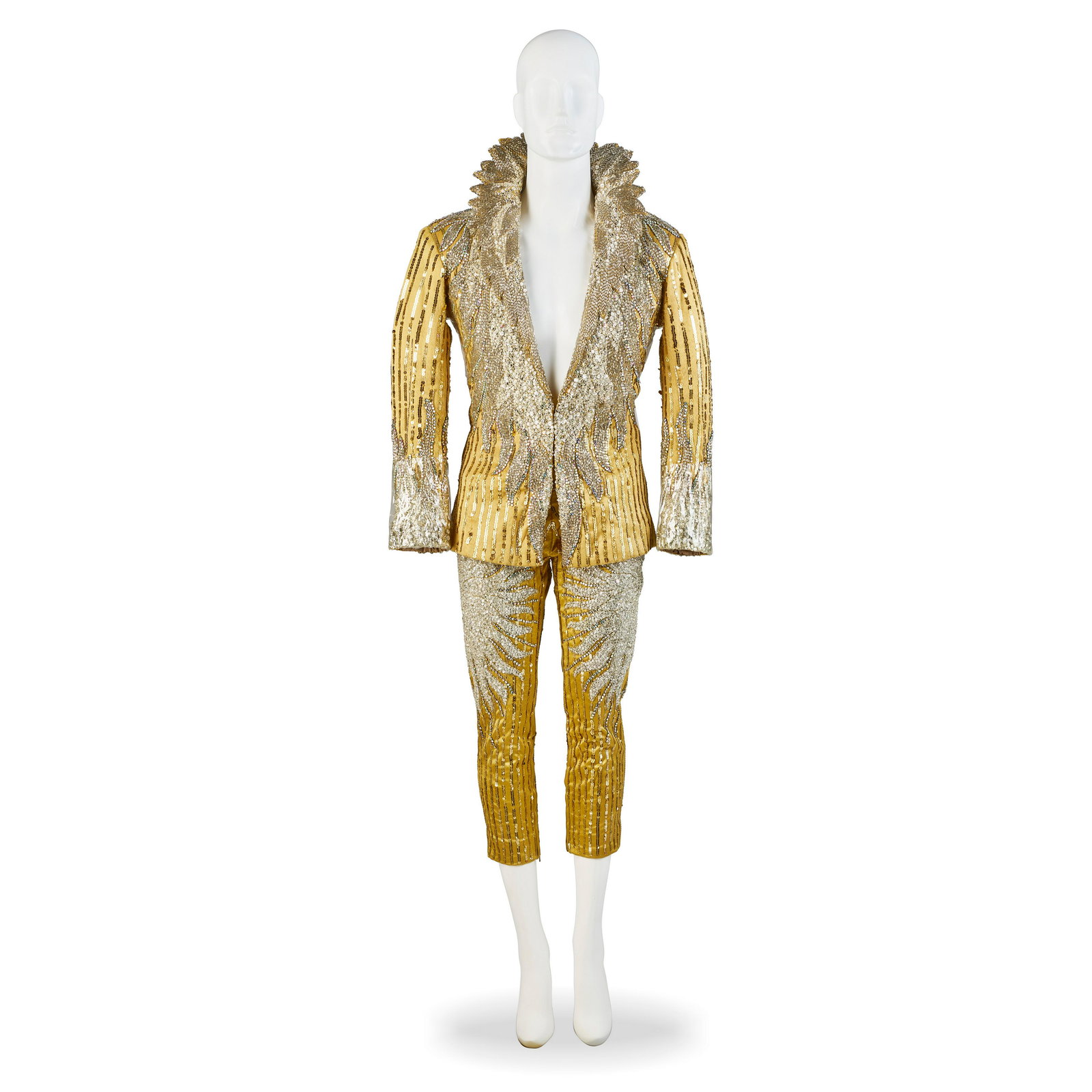 A PAIR OF COSTUMES WORN BY SIEGFRIED & ROY ON STAGE AT THE FRONTIER CIRCA 1980S: A PAIR OF COSTUMES WORN BY SIEGFRIED & ROY ON STAGE AT THE FRONTIER CIRCA 1980S The jackets of gold satin embellished with gold sequins, encrusted with silver bugle beads and aurora borealis rhineston