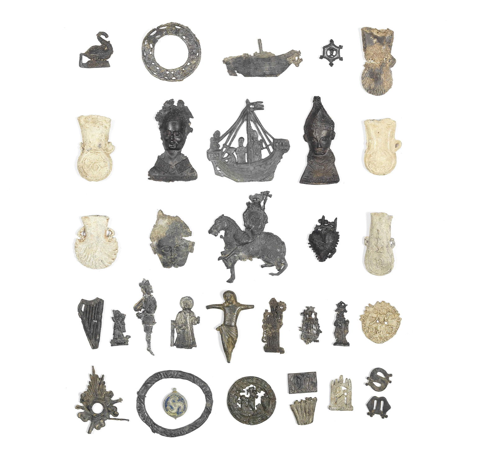 A collection of lead alloy Pilgrim Badges and miniature Pilgrim flasks a lot: A collection of lead alloy Pilgrim Badges and miniature Pilgrim flasks 13th-16th Century and later Including two Becket busts of the Archbishop martyr; another Becket head; a figure of a bishop saint