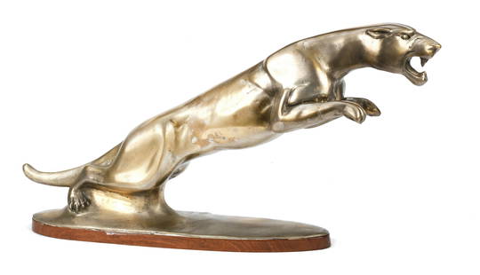 A 'Leaping Jaguar' dealer's showroom display statue,: A 'Leaping Jaguar' dealer's showroom display statue, hollow metal sculpture, modelled upon the famous Jaguar mascot designed by Frederick Gordon Crosby, 66cm long, on a shaped wooden base. This lot is