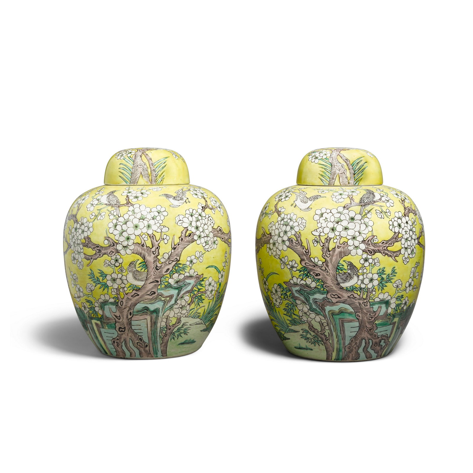 A PAIR OF CHINESE FAMILLE-JAUNE GINGER JARS AND COVERS Kangxi marks, 19th/20th century: A PAIR OF CHINESE FAMILLE-JAUNE GINGER JARS AND COVERS Kangxi marks, 19th/20th century height 11 3/4in (29.8cm)