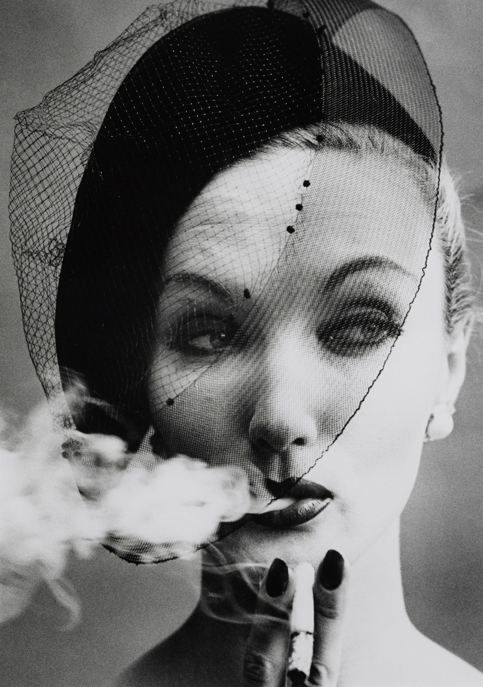 William Klein (born 1928); Smoke + Veil, Paris (Vogue);: William Klein (born 1928) Smoke + Veil, Paris (Vogue), 1958 Gelatin silver print, printed later, signed, titled and dated in pencil on the verso. 17 3/8 x 12 5/8in (44.2 x 32.1cm) Footnotes: Literatu