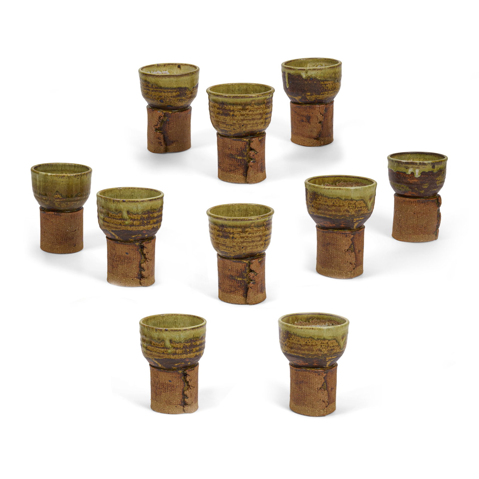 Ten stoneware goblets, School of Charles Loloma: School of Charles Loloma Hopi, (1921-1991), eight partially glazed stoneware goblets, each signed with unidentified artist's cypher. each approximately: height 5in, diameter 3 3/4in Footnotes: Provena