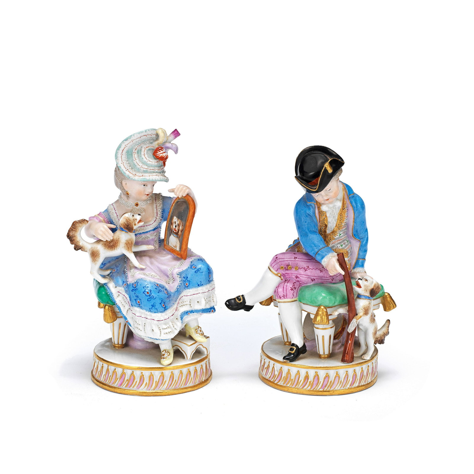 A pair of late 19th century Meissen porcelain figures of a young boy and his female companion wi...: A pair of late 19th century Meissen porcelain figures of a young boy and his female companion with their dogs after the 18th century originals, originally sculpted circa 1776 by Michel Victor Acier (G
