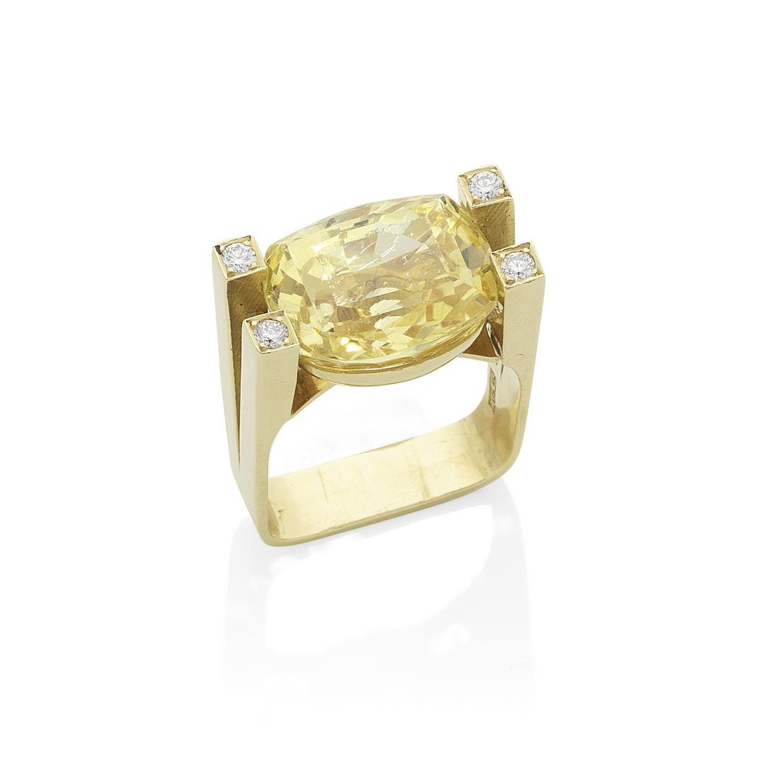 GRIMA: YELLOW SAPPHIRE AND DIAMOND DRESS RING, 1977: GRIMA: YELLOW SAPPHIRE AND DIAMOND DRESS RING, 1977 The cushion-shaped yellow sapphire in a geometric mount with bifurcated shoulders, accented by brilliant-cut diamonds, mounted in 18 carat gold, sig