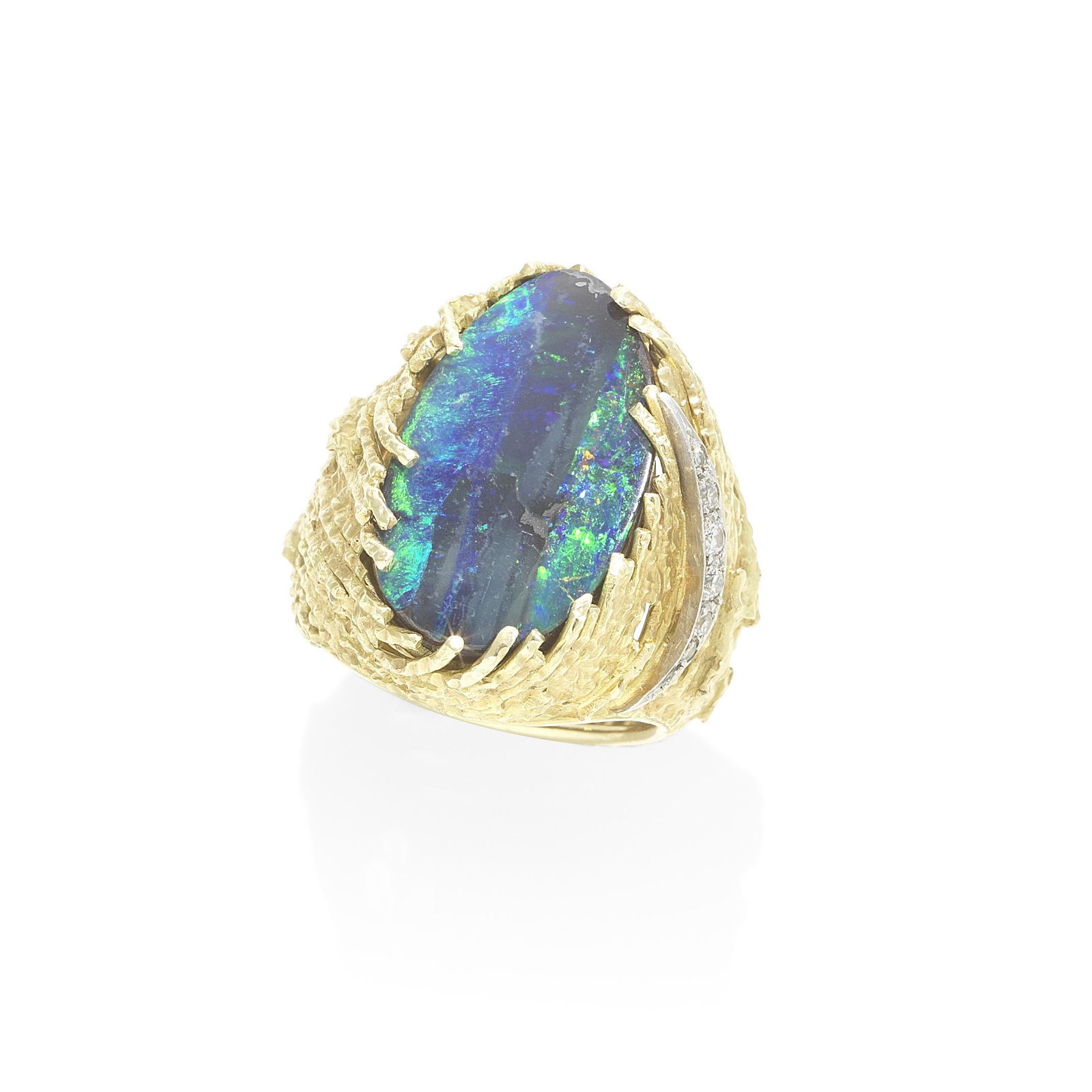 GRIMA: BOULDER OPAL AND DIAMOND DRESS RING, 1977: GRIMA: BOULDER OPAL AND DIAMOND DRESS RING, 1977 The oval boulder opal in a pierced mount of textured wire with brilliant-cut diamond accents, mounted in 18 carat gold, signed Grima, workshop mark HJC