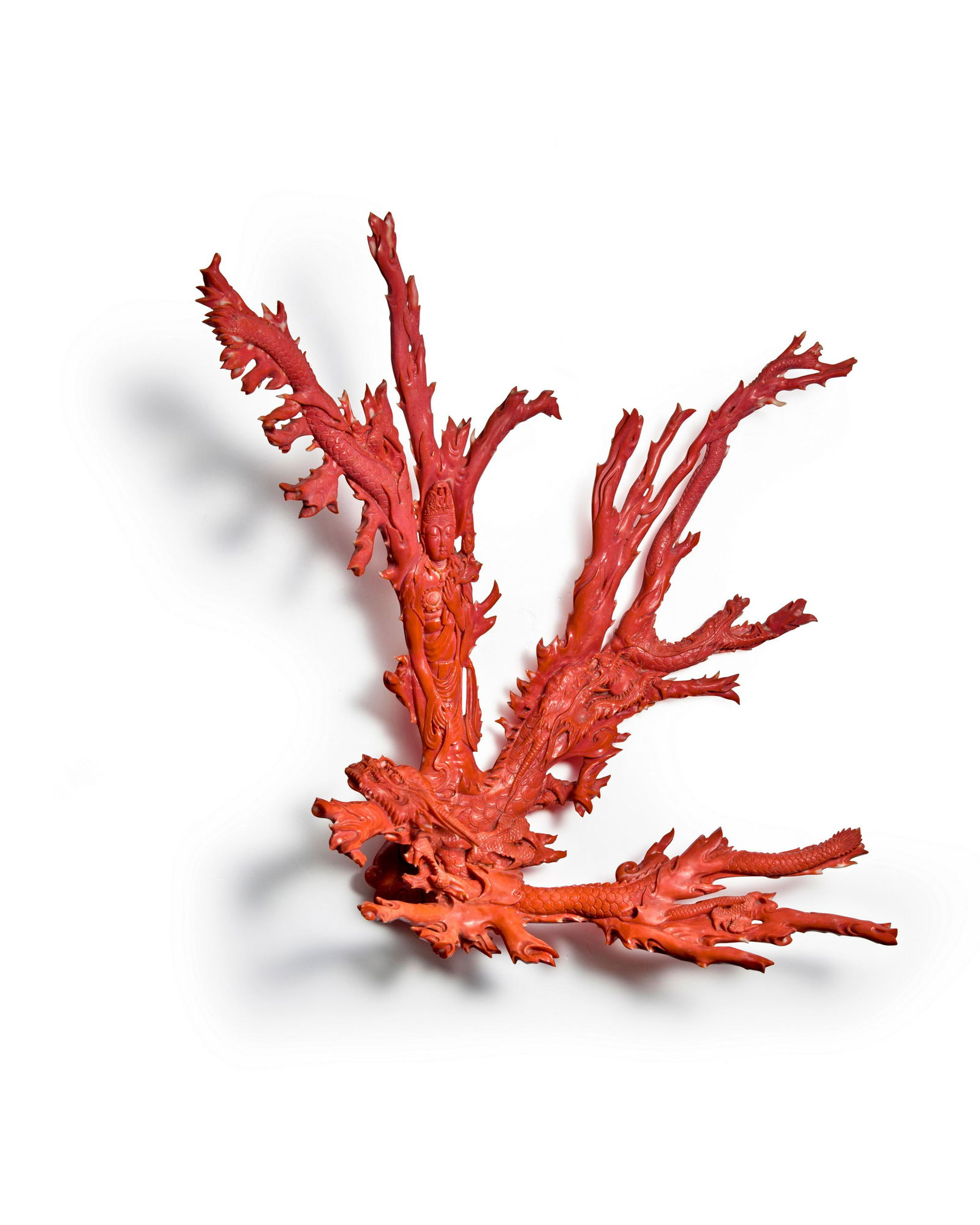 A LARGE CORAL CARVING OF AVOLIKITESVARA AND DRAGONS 19th-20th century (1 of 2)