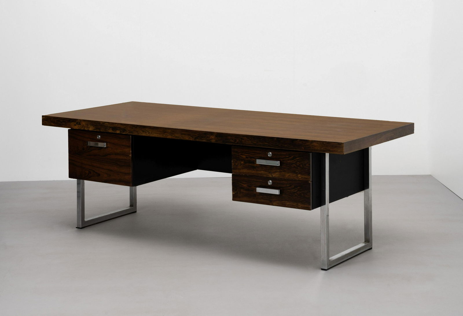 Ray Leigh and Trevor Chinn Desk, model no. R984R, from the 'Series 1' range, designed 1970, prod...: Ray Leigh and Trevor Chinn Desk, model no. R984R, from the 'Series 1' range, designed 1970, produced 1970s Indian rosewood-veneered wood, chromium-plated steel, leather. 73 x 213.2 x 90.5 cm Manufactu