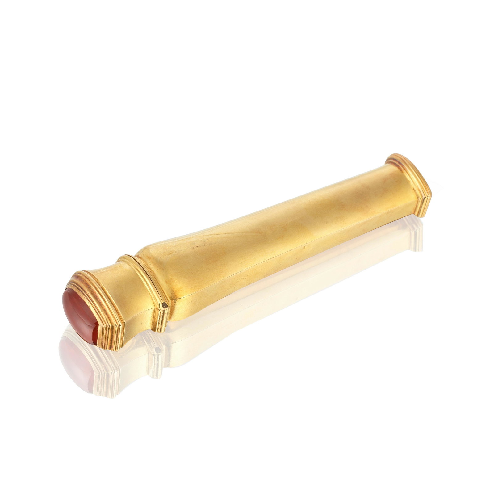 A mid-18th century gold and cornelian sealing wax case later Austrian mark: A mid-18th century gold and cornelian sealing wax case later Austrian mark Ovoid section, shouldered tapering form, the hinged reeded cover set with a carnelian, the base with an engraved seal with cu